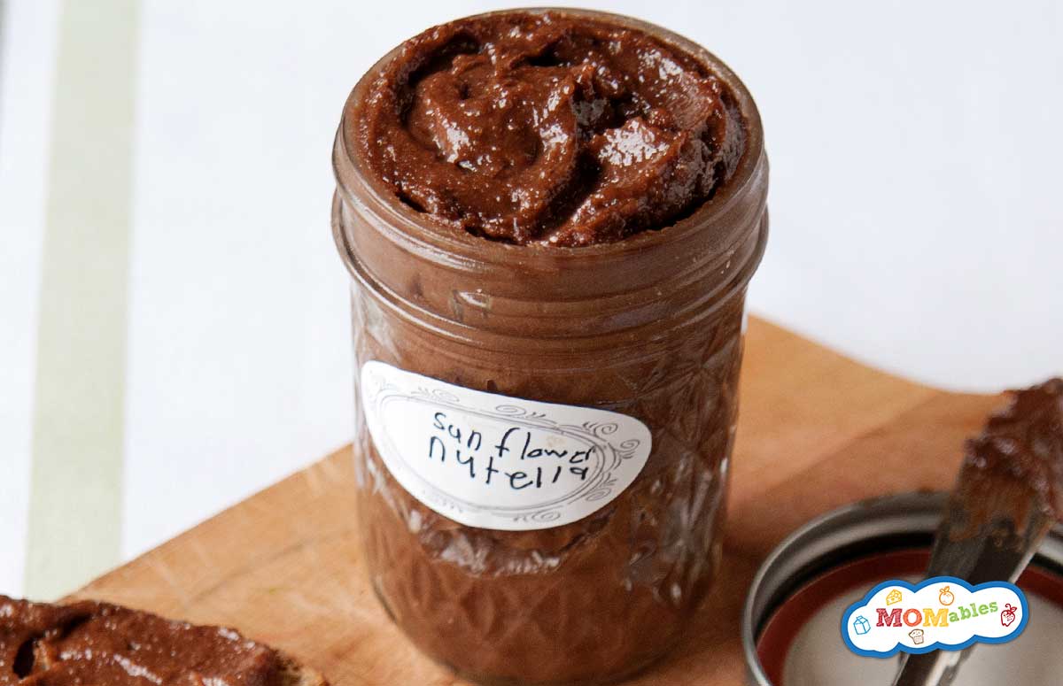 nut free chocolate spread in a jar and spread over two slices of toast
