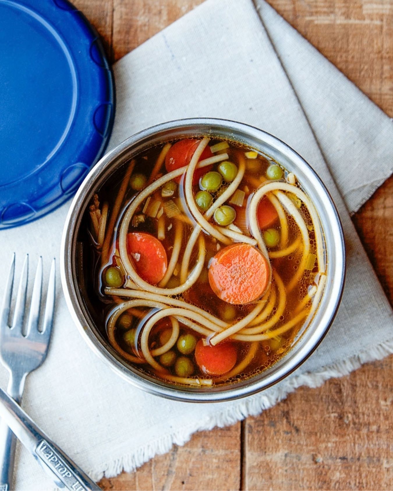 overhead view of ramen noodle soup in a thermos