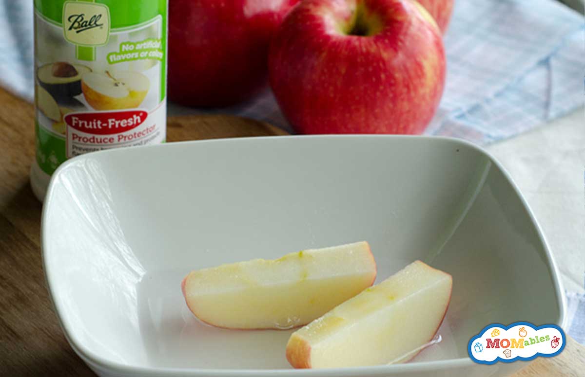 apple slices in a shallow bowl with Fruit Fresh
