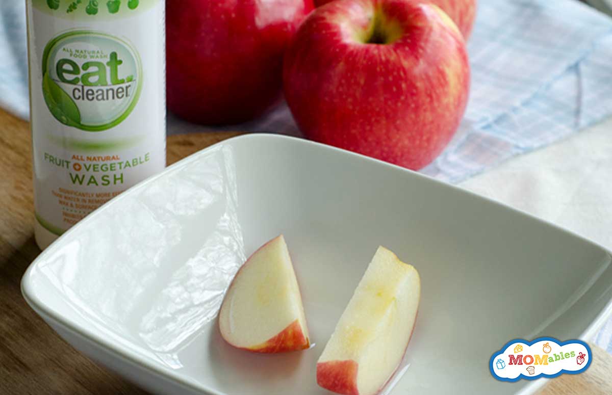 eat cleaner spray with apple slices in a shallow bowl