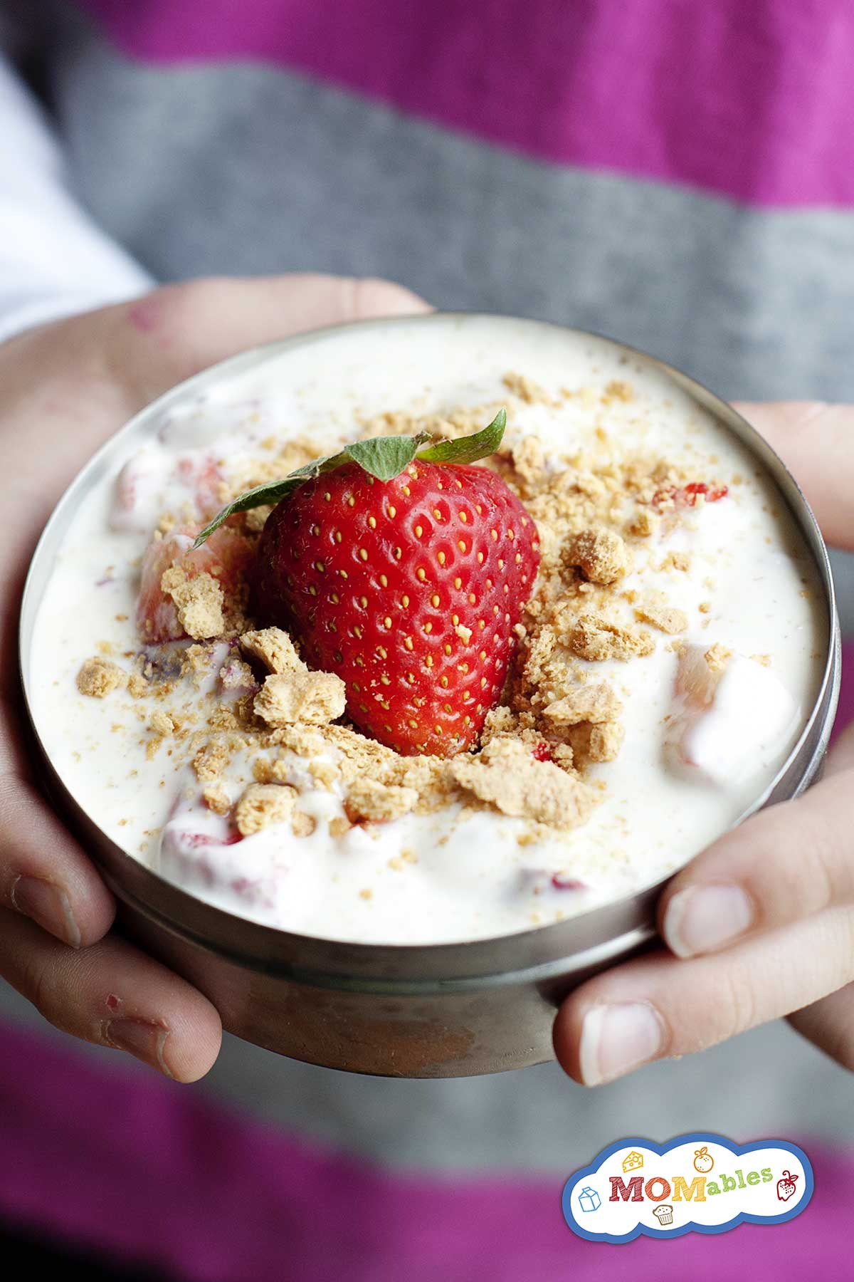 small thermos container filled with a strawberry parfait