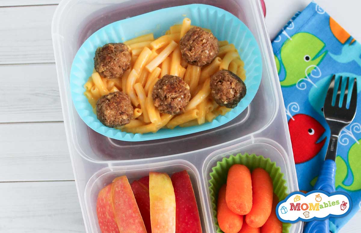 mini tuna balls with mac and cheese, apple slices and baby carrots in a lunchbox