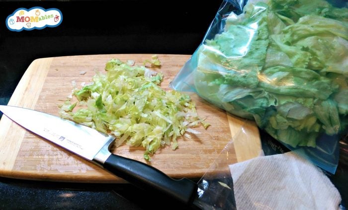 lettuce shredded on a cutting board 
