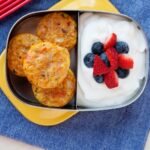 mini quiches in a lunchbox with yogurt on the side
