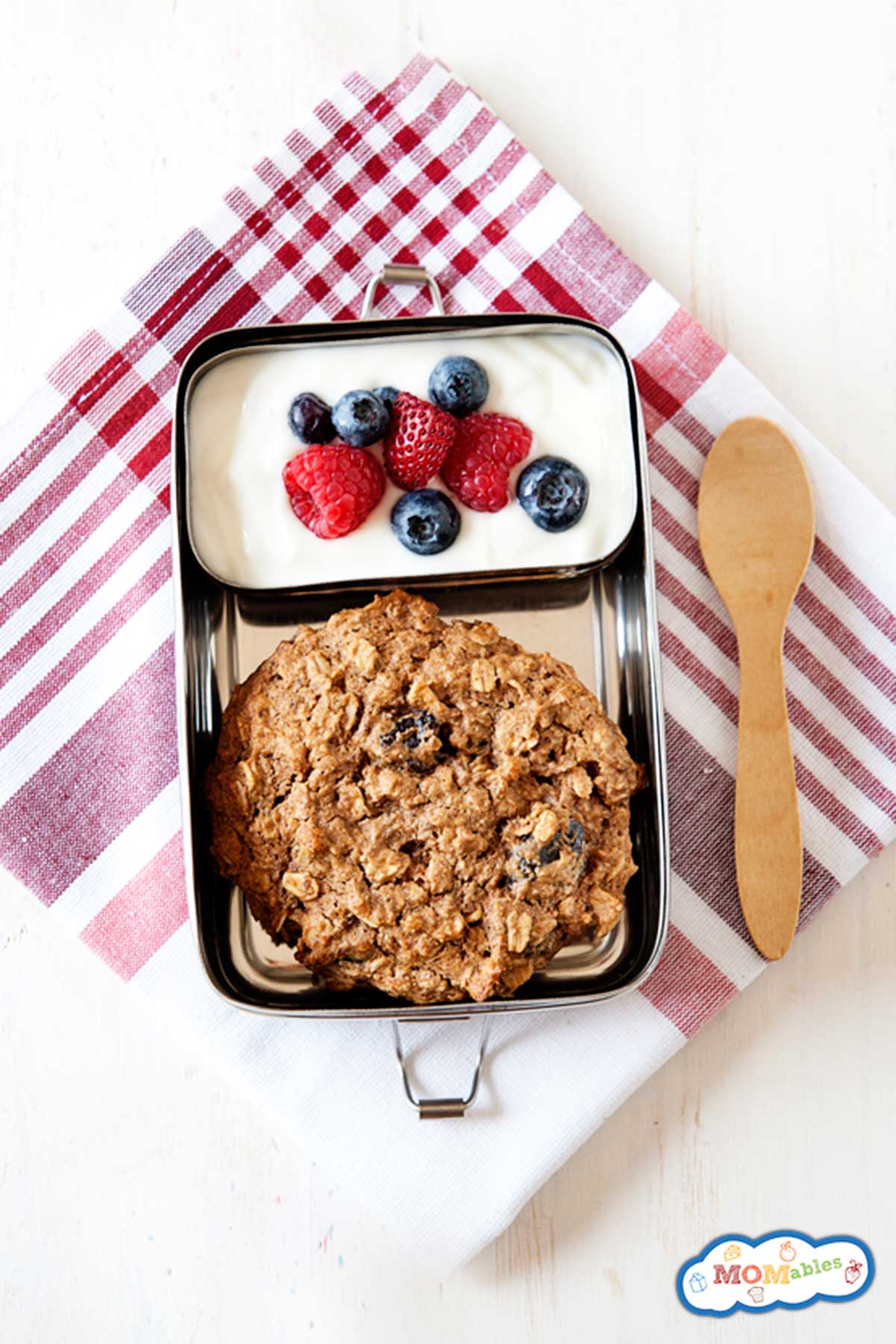 large breakfast cookie packed in lunch container with yogurt