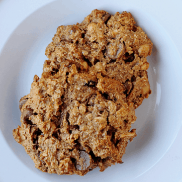 two large oatmeal cookies on a plate 