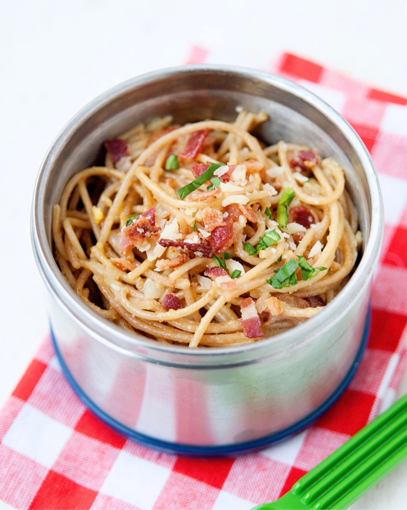 spaghetti carbonara in a metal thermos lunch