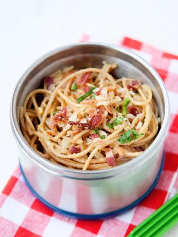 spaghetti carbonara in a metal thermos lunch