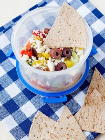 7 Layer Greek Dip in a lunch container