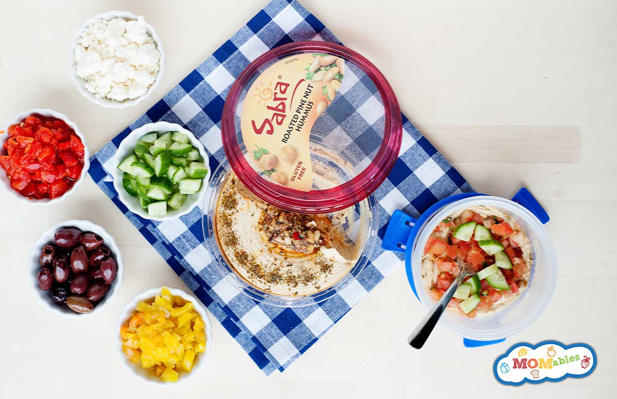 ingredients of 7 Layer Greek Dip in a lunch container