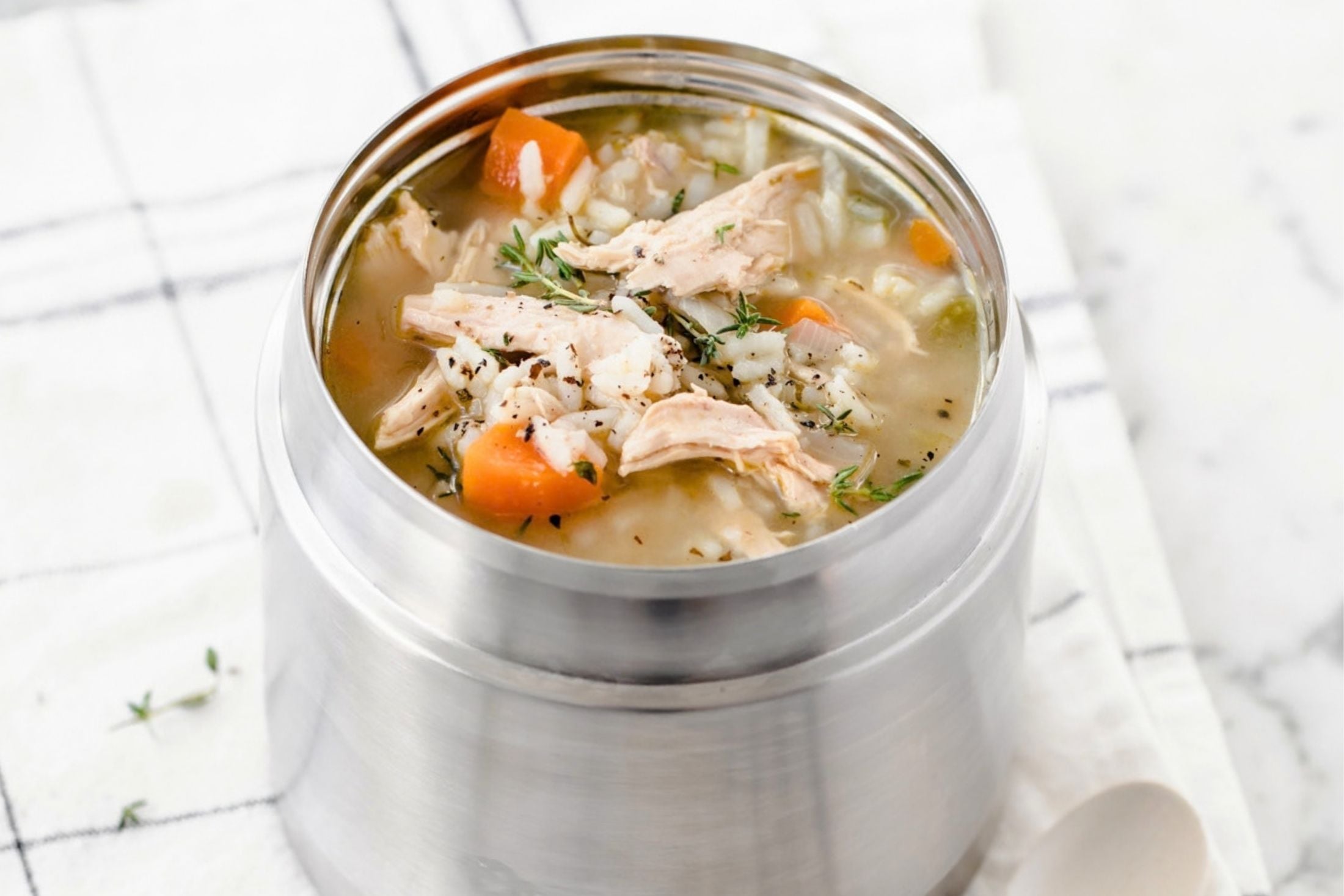 chicken and rice soup in a metal thermos