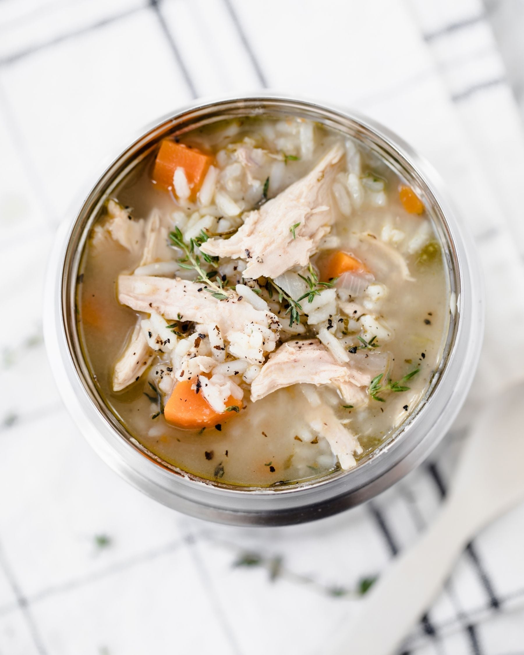 chicken and rice soup in a metal thermos