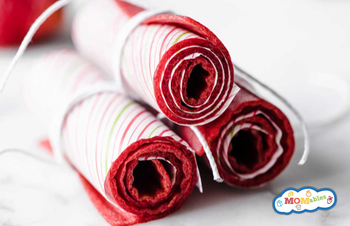 3 homemade fruit rolls up stacked together.