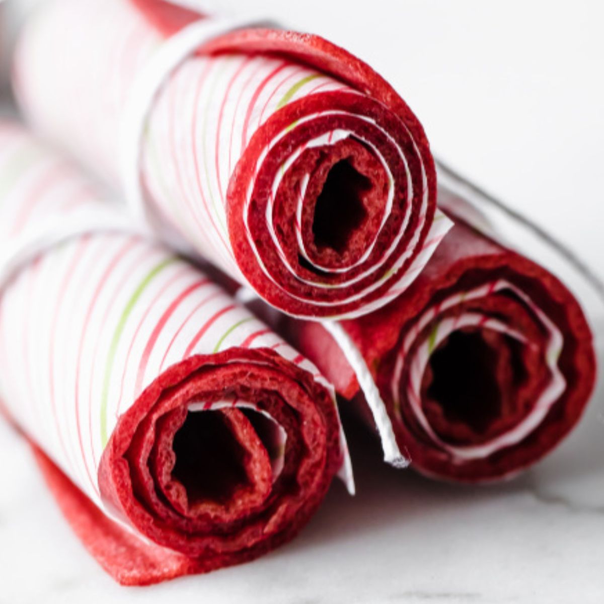 three rolls of strawberry fruit leather