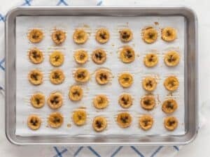 baked banana chips on a baking sheet