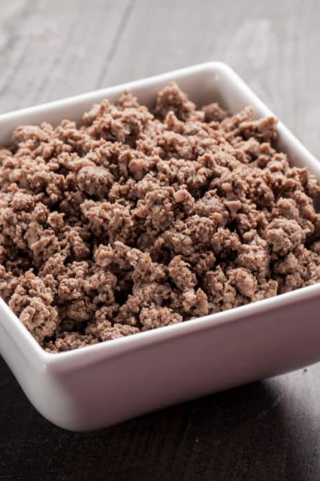 image: square bowl of cooked ground beef. 