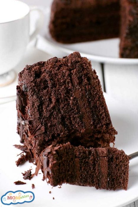 large slice of chocolate cake frosted with chocolate icing