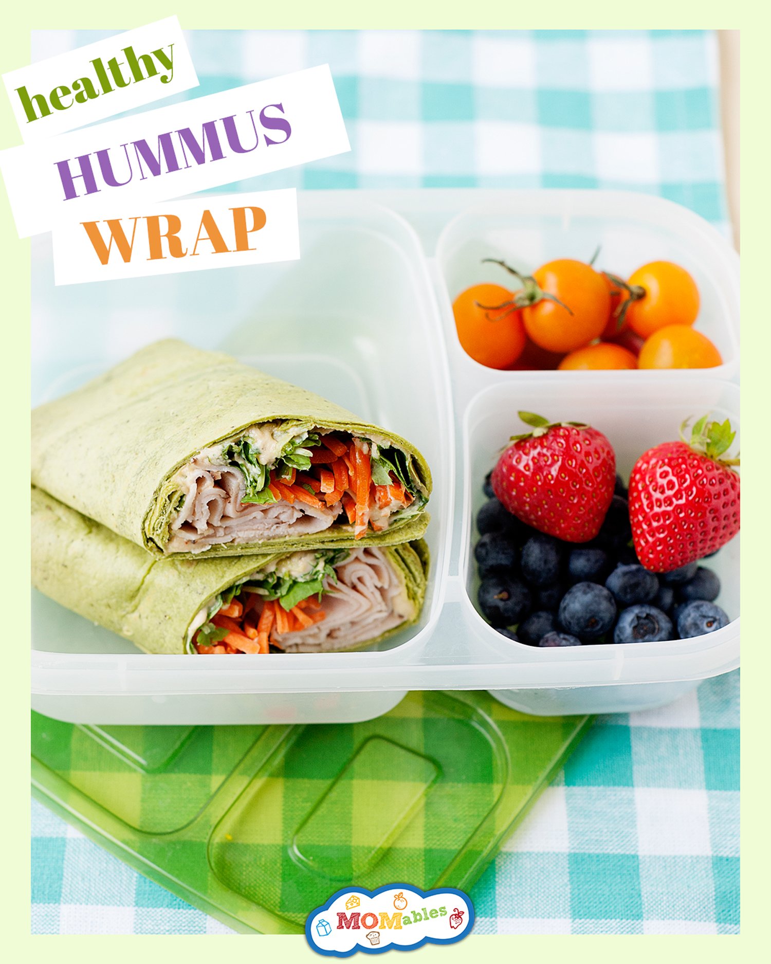 hummus wrap in a lunch container with berries