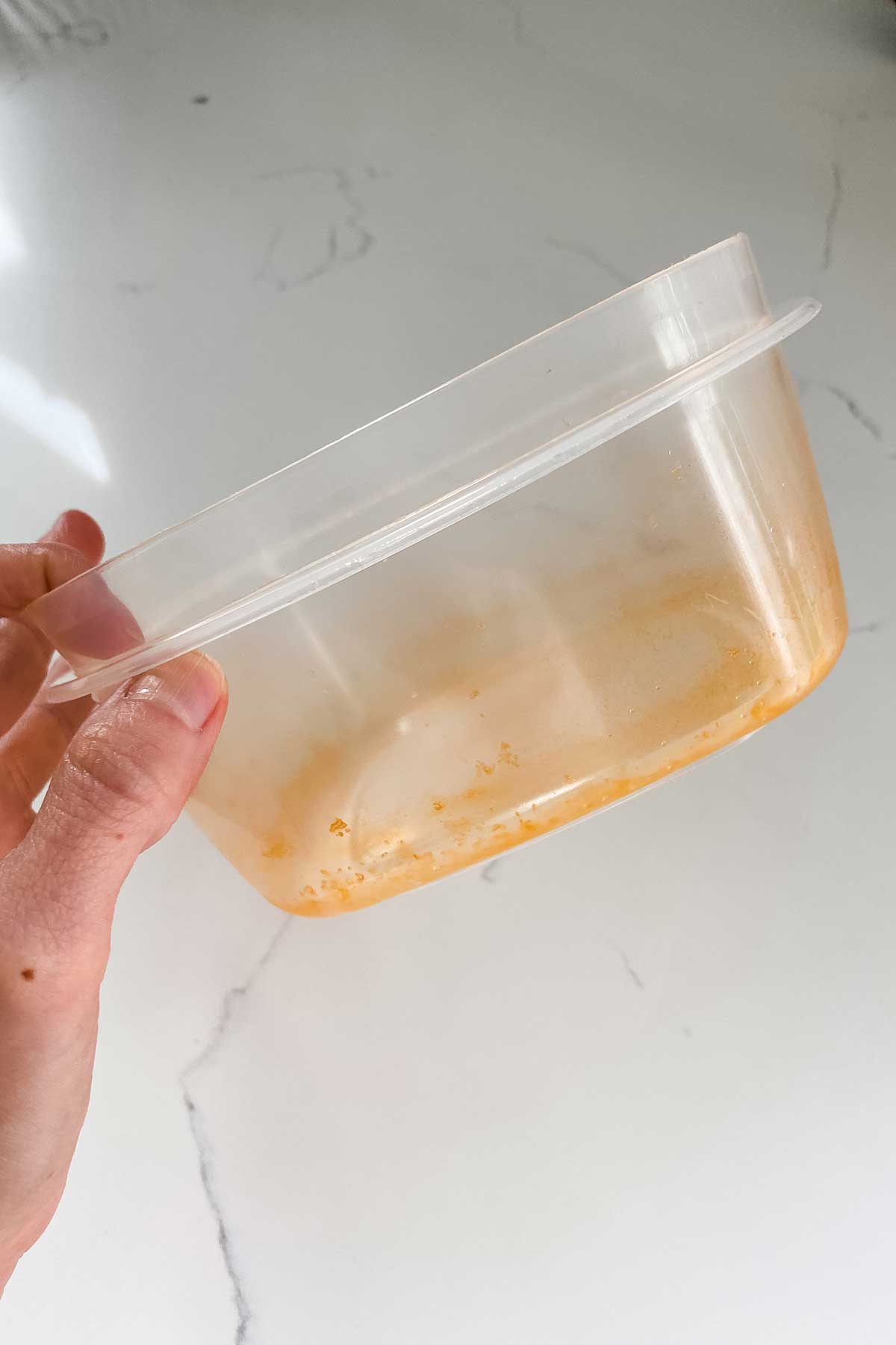stained plastic container