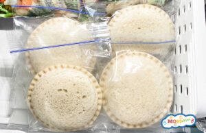 frozen uncrustables in zip bags in the freezer