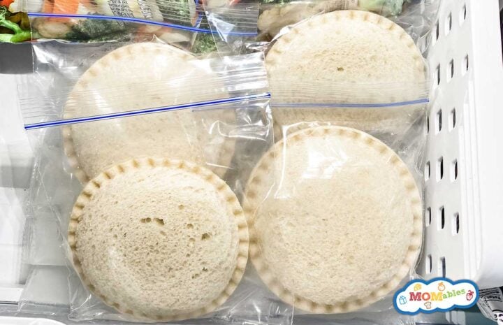 frozen uncrustables in zip bags in the freezer