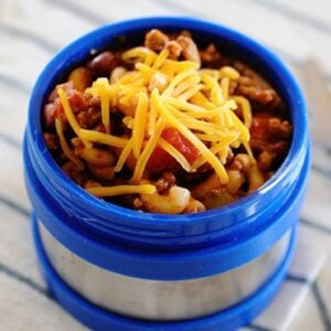 chili mac topped with cheese in a thermos