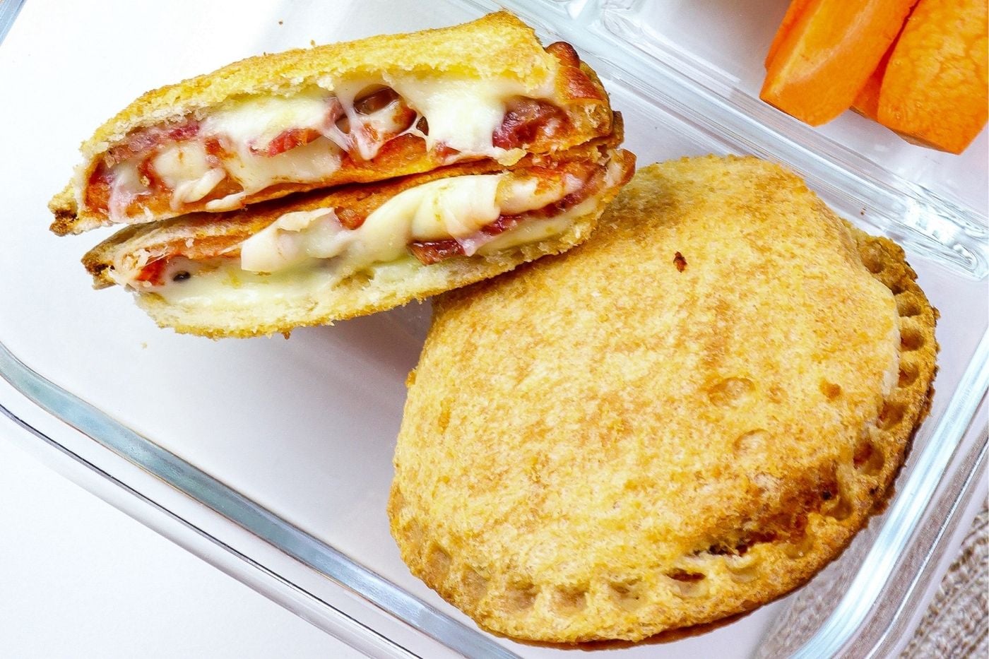 pizza uncrustable packed into a lunch container