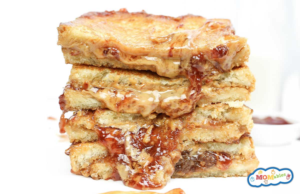Grilled pb & j sandwich sliced in half and stacked.