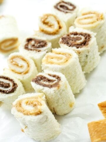 two skewers of sandwich rolls with peanut butter and nutella
