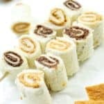 two skewers of sandwich rolls with peanut butter and nutella
