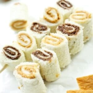 two skewers of sandwich rolls with peanut butter and nutella