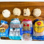 four gluten-free uncrustables on a cutting board with four different types of gluten free bread loaves