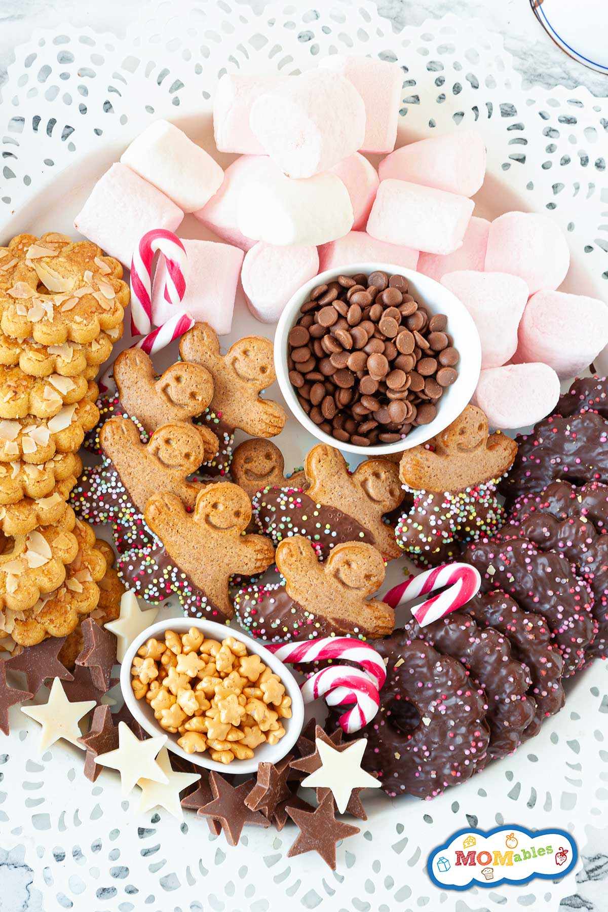 large bowl of hot cocoa toppings an cookies