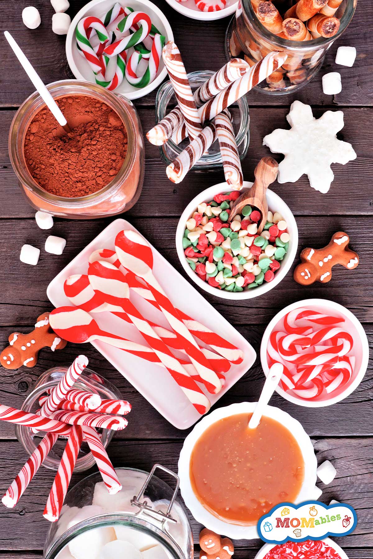 overhead view of toppings and mix-ins for hot chocolate laid out on a board