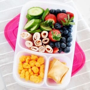 fruits and veggies and turkey inside a lunch container