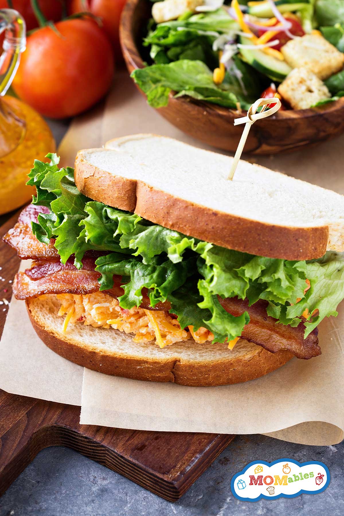 pimento cheese btl sandwich on a wooden board