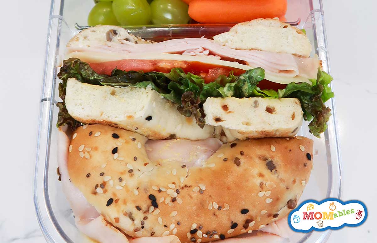 closeup of a turkey bagel sandwich in a lunchbox