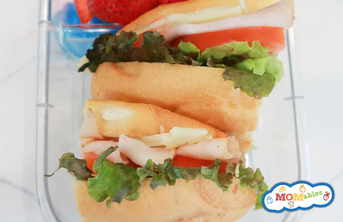 overhead view of turkey sub sandwich in a lunchbox