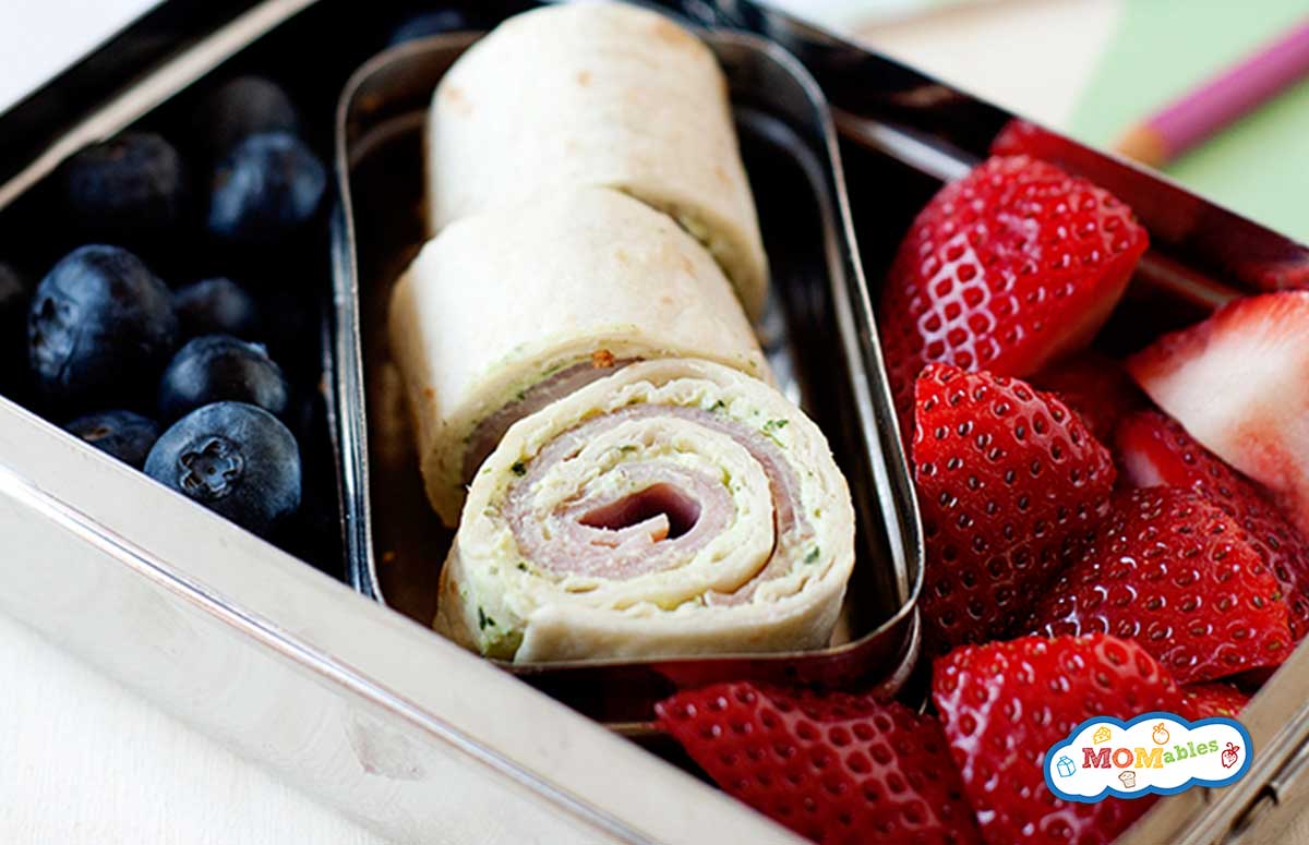 turkey pesto pinwheels and berries in a lunchbox