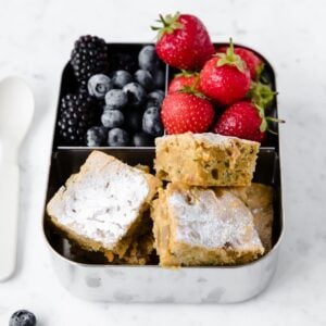 zucchini carrot bars and fruits in a lunchbox