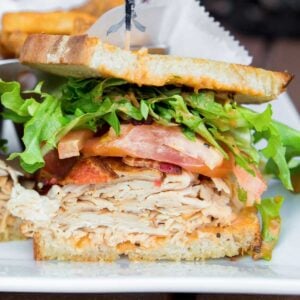 sandwich with deli chicken and bacon, lettuce, tomato for school lunch.