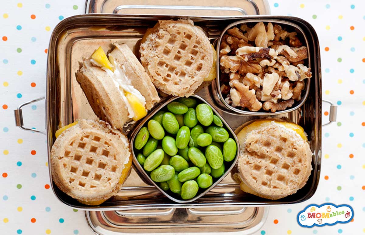 breakfast bento with waffle sandwiches, walnuts and edamame beans