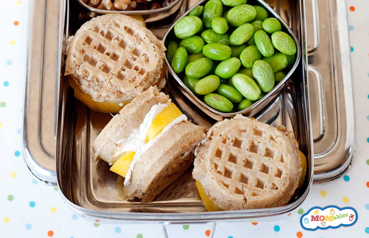 breakfast bento with waffle sandwiches, walnuts and edamame beans