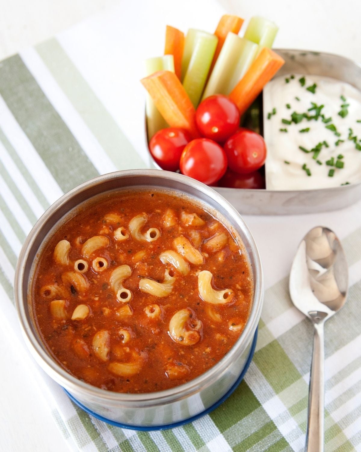 tomato pasta soup in a thermos and a lunchbox with veggies and ranch