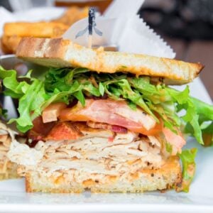 sandwich with chicken, bacon, and veggies