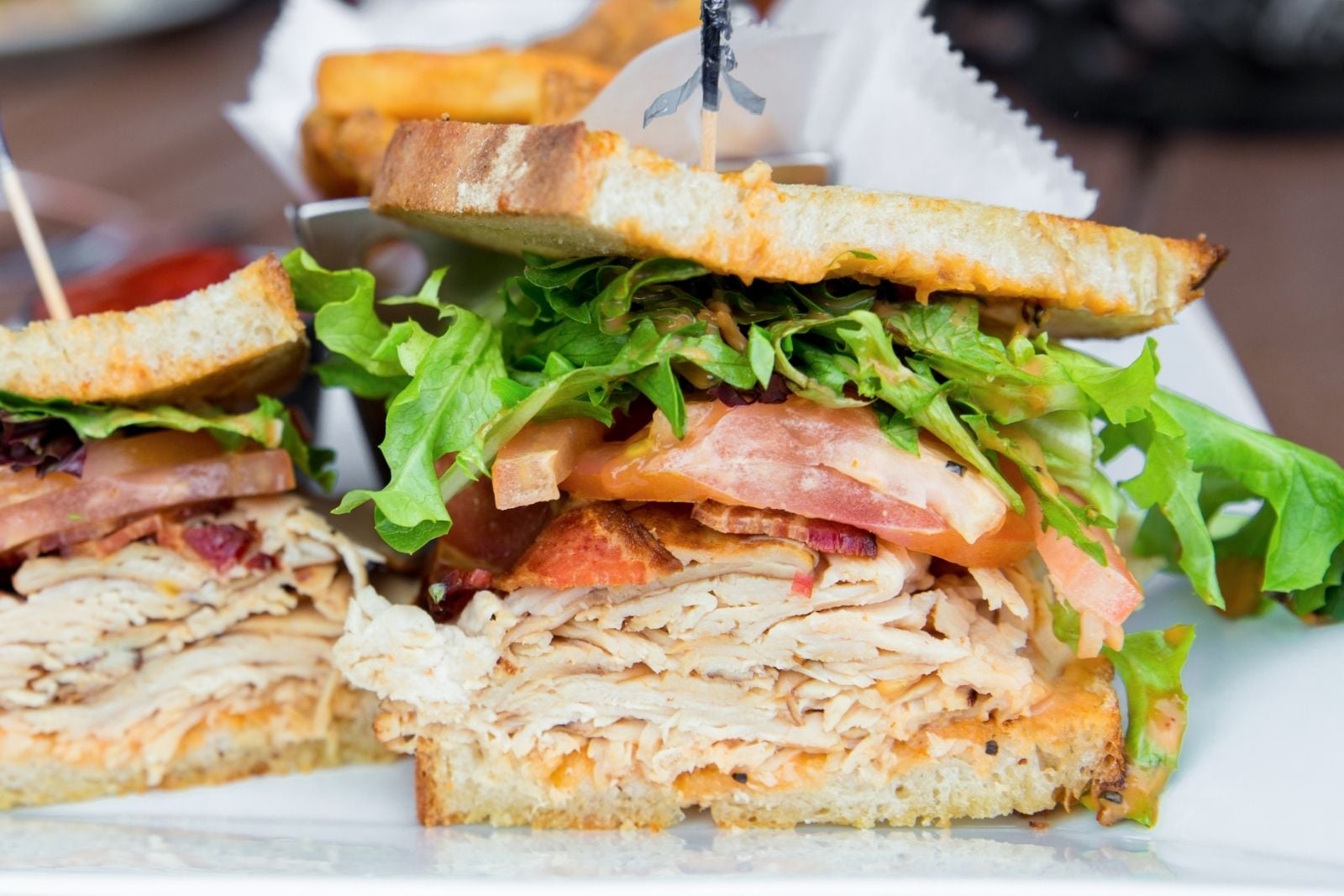 sandwich with chicken, bacon, and veggies