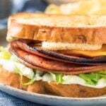 fried bologna sandwich with cheese, lettuce, mayo and toasted bread