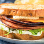 fried bologna sandwich with cheese, lettuce, mayo and toasted bread