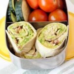 closeup of tortilla avocado pinwheels in a lunch container