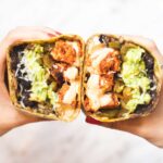 two halves of a chipotle chicken wrap